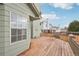 Spacious wooden back deck of two-story home provides outdoor living space at 12690 W Brandt Dr, Littleton, CO 80127