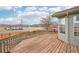 Large back deck with wood railings overlooking neighborhood street, providing great views at 12690 W Brandt Dr, Littleton, CO 80127