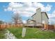 Large backyard with green lawn, wood fence and deck perfect for outdoor living at 12690 W Brandt Dr, Littleton, CO 80127