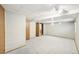 Open basement featuring a large room and wood trim throughout at 12690 W Brandt Dr, Littleton, CO 80127
