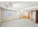 Finished basement featuring carpet floors and natural light at 12690 W Brandt Dr, Littleton, CO 80127