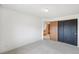 Carpeted bedroom with neutral walls and standard lighting at 12690 W Brandt Dr, Littleton, CO 80127