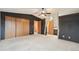 Carpeted bedroom features dark walls and open doorways at 12690 W Brandt Dr, Littleton, CO 80127