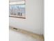 Bedroom featuring neutral carpet, a large window, and bright natural light at 12690 W Brandt Dr, Littleton, CO 80127