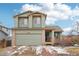 Charming two-story home with an attached garage, brick accents and freshly painted in a neutral color palette at 12690 W Brandt Dr, Littleton, CO 80127