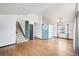 Bright living room with hardwood floors and a stairway at 12690 W Brandt Dr, Littleton, CO 80127