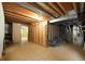 Unfinished basement area with exposed ceiling and wood beams at 12690 W Brandt Dr, Littleton, CO 80127