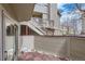 Private back patio area with wood tiling and rock detail at 275 Pearl St # 11, Boulder, CO 80302