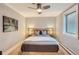 Serene bedroom featuring a modern ceiling fan, gray walls, and a large window for natural light at 275 Pearl St # 11, Boulder, CO 80302