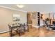 Open-concept dining area with modern table and chairs, seamlessly connected to the living room and kitchen at 275 Pearl St # 11, Boulder, CO 80302
