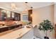 Stylish kitchen area with light countertops, dark cabinets, and unique pendant lighting at 275 Pearl St # 11, Boulder, CO 80302