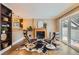 Inviting living room featuring a cozy fireplace, stylish seating, and sliding glass doors to the private balcony at 275 Pearl St # 11, Boulder, CO 80302