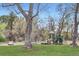 Community playground with modern play equipment and surrounded by lush greenery and large trees at 275 Pearl St # 11, Boulder, CO 80302
