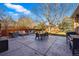 Expansive backyard patio with ample seating and a built-in outdoor fire pit at 4074 S Poplar Way, Denver, CO 80237