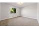 Cozy bedroom with neutral carpet, a bright window, and natural lighting at 4074 S Poplar Way, Denver, CO 80237