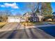 Beautiful home featuring a two-car garage and a well-maintained front lawn at 4074 S Poplar Way, Denver, CO 80237