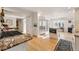 Open kitchen layout with stainless steel appliances, granite countertops, and hardwood floors at 4074 S Poplar Way, Denver, CO 80237
