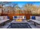Cozy outdoor patio featuring a fire pit and comfortable seating, perfect for entertaining at 4074 S Poplar Way, Denver, CO 80237