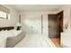 Cozy bedroom with hardwood floors, white closets, and neutral tones at 2060 Kline St, Lakewood, CO 80215