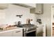 Close-up of a modern kitchen with stainless steel appliances and stylish countertops at 2060 Kline St, Lakewood, CO 80215
