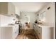 Modern kitchen with white countertops, sleek appliances, and ample storage space at 2060 Kline St, Lakewood, CO 80215