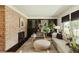Stylish living room featuring a brick fireplace and comfortable seating at 2060 Kline St, Lakewood, CO 80215