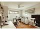 Contemporary home office with multiple work stations, hardwood floors, and plenty of natural light at 2060 Kline St, Lakewood, CO 80215