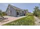 Large backyard with brick patio and small patches of lawn at 12993 E 108Th Ave, Commerce City, CO 80022