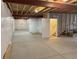 Unfinished basement with concrete floor, open ceiling, and exposed structure at 12993 E 108Th Ave, Commerce City, CO 80022