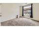 Bedroom with plush carpet, window with dark curtains, and a closet at 12993 E 108Th Ave, Commerce City, CO 80022