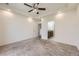 Spacious bedroom with neutral carpet, tray ceilings, recessed lights, and an ensuite bathroom at 12993 E 108Th Ave, Commerce City, CO 80022