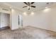 Bedroom with carpet, ceiling fan, closet, and ensuite bathroom at 12993 E 108Th Ave, Commerce City, CO 80022