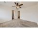 Clean bedroom with carpet and an open bathroom at 12993 E 108Th Ave, Commerce City, CO 80022