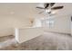 Neutral bonus room featuring a ceiling fan and natural light at 12993 E 108Th Ave, Commerce City, CO 80022