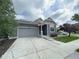Lovely home with a spacious driveway, two-car garage, and a welcoming front porch at 12993 E 108Th Ave, Commerce City, CO 80022