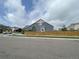 A blue two story home with a wooden fence and well maintained lawn at 12993 E 108Th Ave, Commerce City, CO 80022