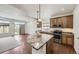 Well-equipped kitchen featuring granite countertops, stainless steel appliances, and a functional island at 12993 E 108Th Ave, Commerce City, CO 80022