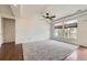 Spacious main bedroom with large windows offering natural light, plush carpet, and hardwood flooring at 12993 E 108Th Ave, Commerce City, CO 80022