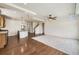 Open floorplan featuring hardwood floors, a kitchen island, and seamless living spaces at 12993 E 108Th Ave, Commerce City, CO 80022