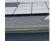 Close-up of house roof featuring modern solar panels, promoting energy efficiency and sustainability at 12993 E 108Th Ave, Commerce City, CO 80022