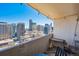 A balcony featuring a seating area with a view of the city skyline at 1020 15Th St # 28G, Denver, CO 80202