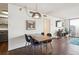 Bright dining area with modern lighting and a view of the living space at 1020 15Th St # 28G, Denver, CO 80202