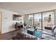 Cozy living room featuring a leather couch and city skyline views at 1020 15Th St # 28G, Denver, CO 80202