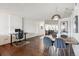 Open-concept living room with dining area and sliding door to balcony at 1020 15Th St # 28G, Denver, CO 80202