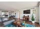 Spacious open-concept living room with adjacent dining area at 1020 15Th St # 28G, Denver, CO 80202