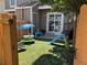 Fenced backyard featuring artificial turf and a variety of play equipment for  at 15507 E Louisiana Ave, Aurora, CO 80017