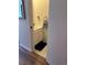 Convenient powder room featuring a vanity with storage and stylish fixtures at 15507 E Louisiana Ave, Aurora, CO 80017