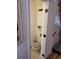 Efficiently designed half bathroom offering a toilet and vanity with storage at 15507 E Louisiana Ave, Aurora, CO 80017