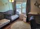 Bedroom with twin beds, a changing table, hardwood floors, and natural light at 15507 E Louisiana Ave, Aurora, CO 80017