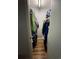 Walk-in closet with clothing racks on both sides and hardwood flooring at 15507 E Louisiana Ave, Aurora, CO 80017